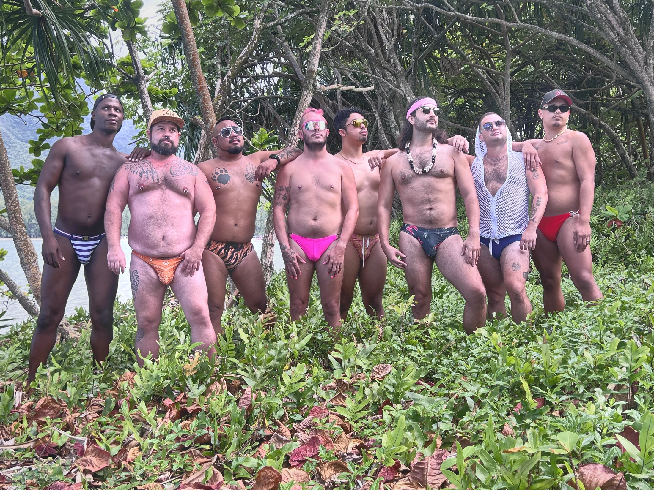 Group looking away beneath trees