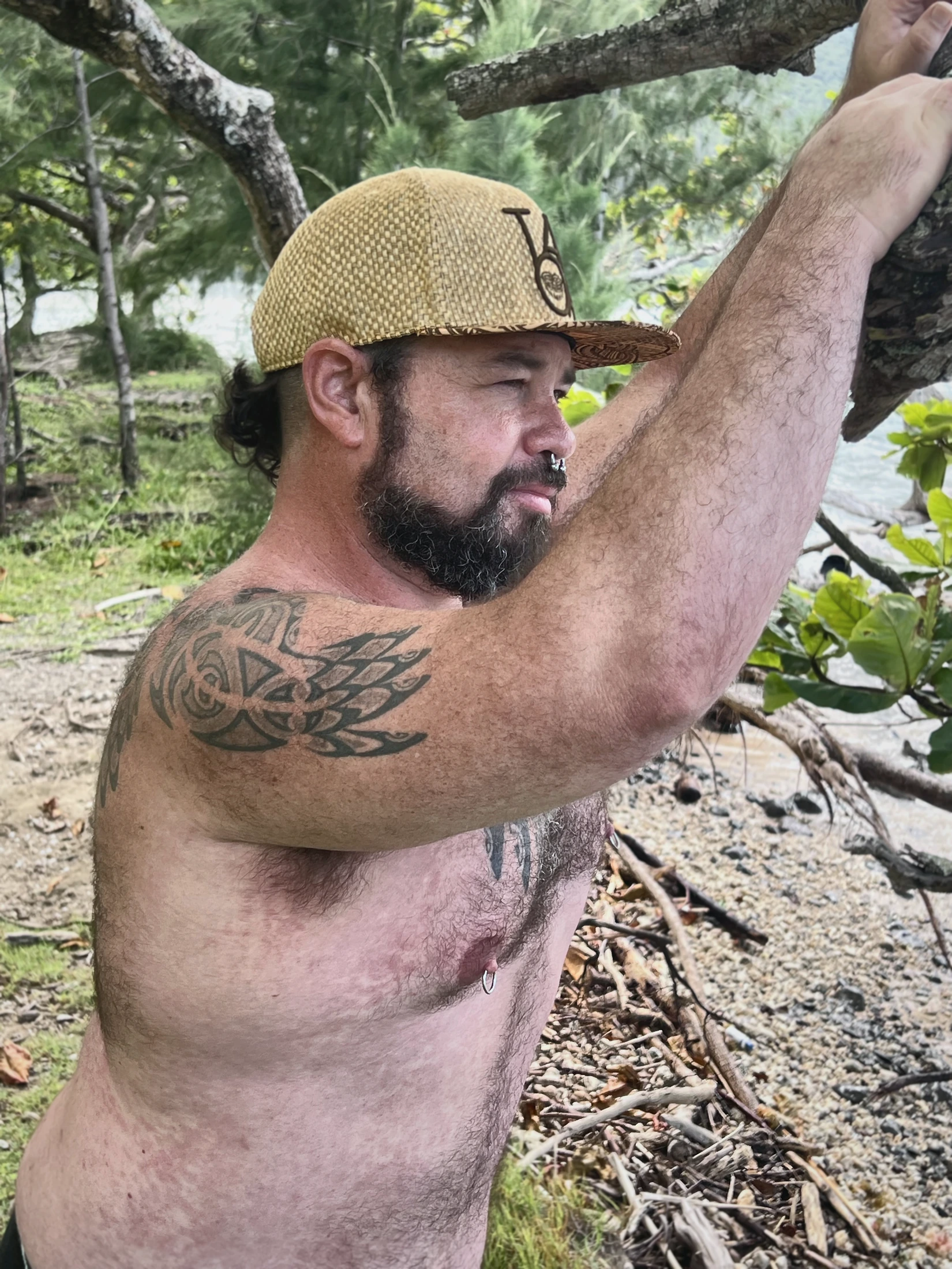 Close individual portrait beneath a tree